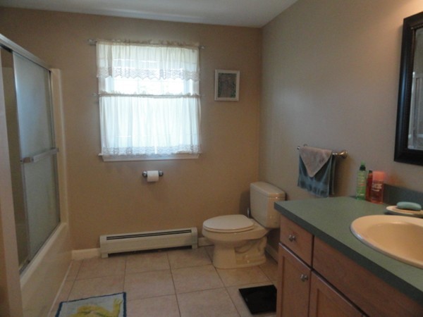 128 Brandy Hill Road Thompson, CT 06277 - Photo 18 of 26 a bathroom with a sink toilet and window