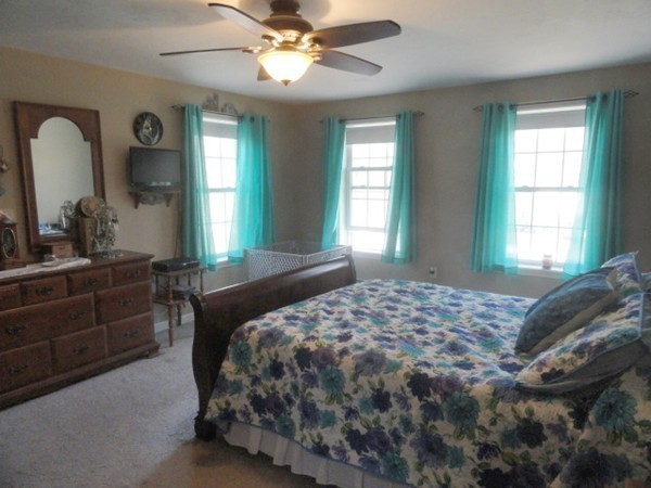 128 Brandy Hill Road Thompson, CT 06277 - Photo 19 of 26 a bedroom with a large bed and a window
