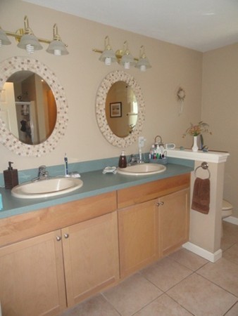 128 Brandy Hill Road Thompson, CT 06277 - Photo 20 of 26 a bathroom with a double vanity sink and a mirror