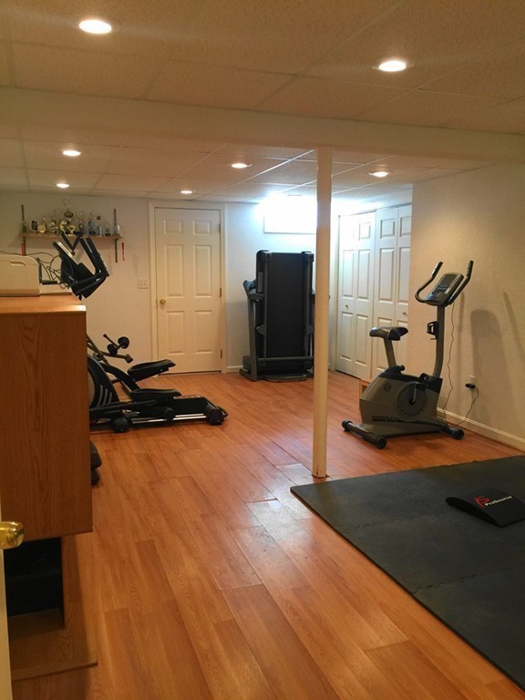 128 Brandy Hill Road Thompson, CT 06277 - Photo 22 of 26 a room with gym equipment and a view of living room