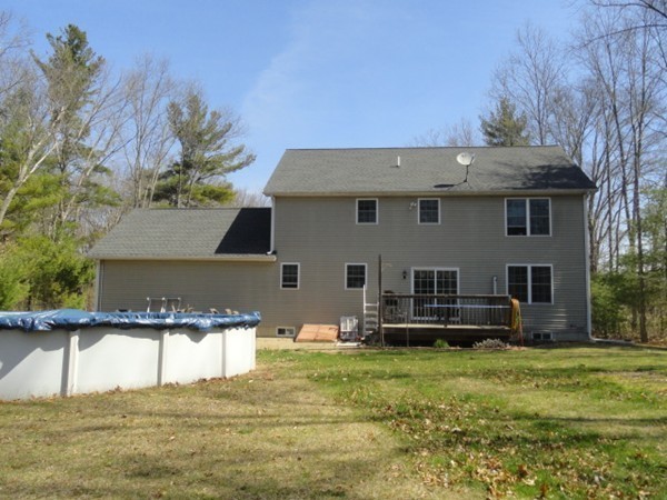 128 Brandy Hill Road Thompson, CT 06277 - Photo 23 of 26 a front view of a house with a yard