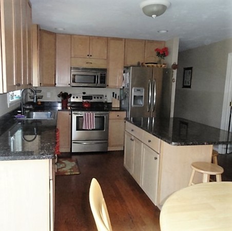 128 Brandy Hill Road Thompson, CT 06277 - Photo 5 of 26 a kitchen with granite countertop a refrigerator stove and sink