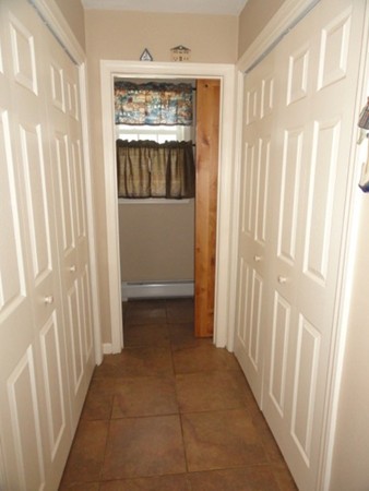 128 Brandy Hill Road Thompson, CT 06277 - Photo 8 of 26 a view of a hallway with a window and a door