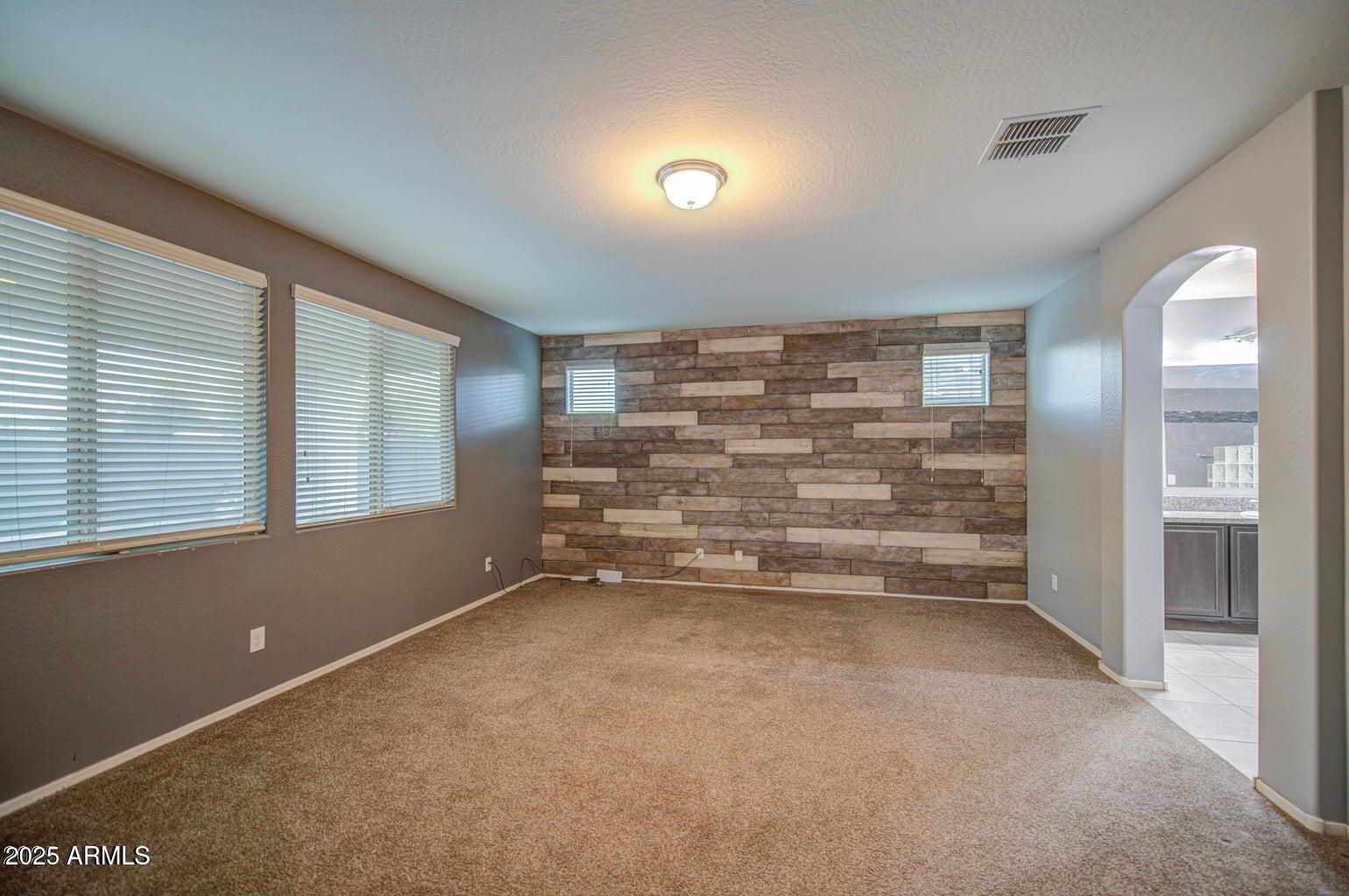 6815 South 19th Lane Phoenix, AZ 85041 - Photo 14 of 40 a view of room with walk in closet