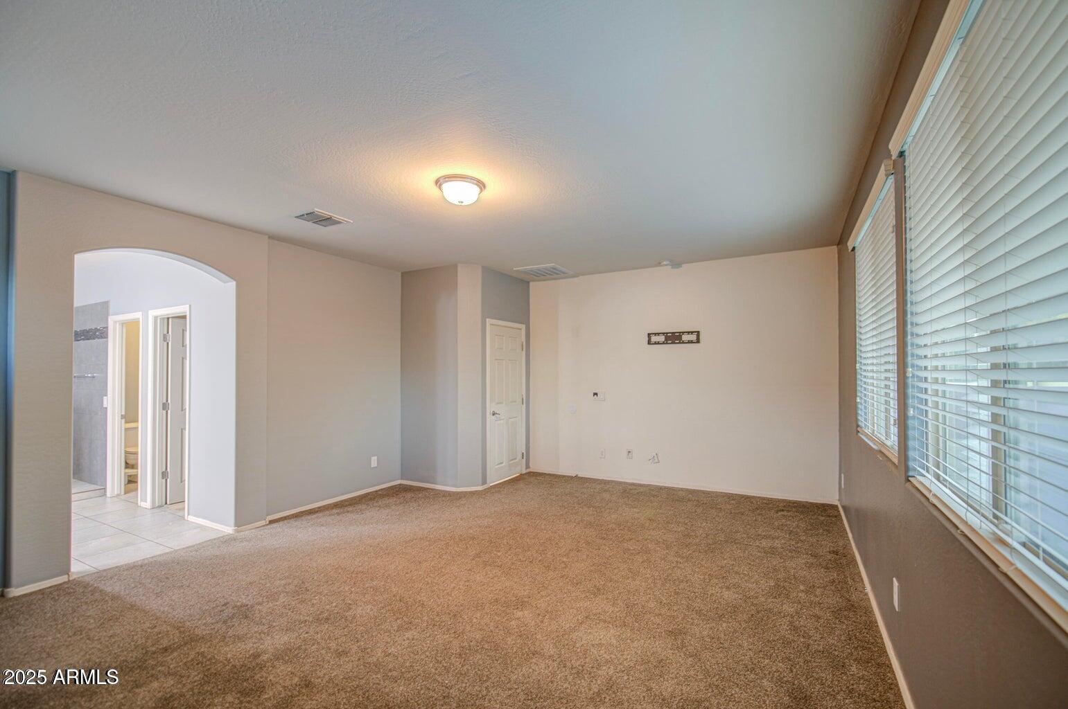 6815 South 19th Lane Phoenix, AZ 85041 - Photo 15 of 40 a view of an empty room