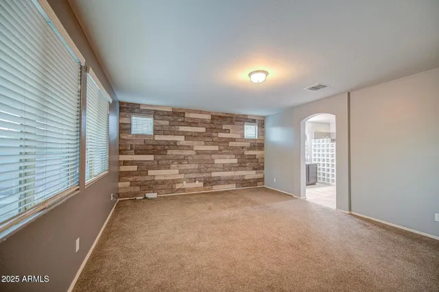 a view of room with balcony and a hallway