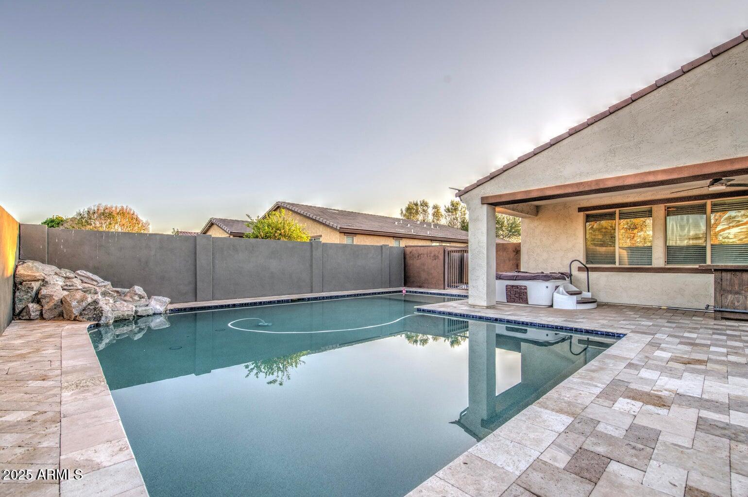 6815 South 19th Lane Phoenix, AZ 85041 - Photo 31 of 40 a view of a swimming pool with a lake view
