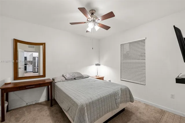 a view of a hallway with white walls