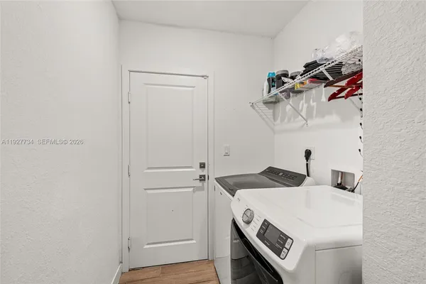 a utility room with dryer and washer