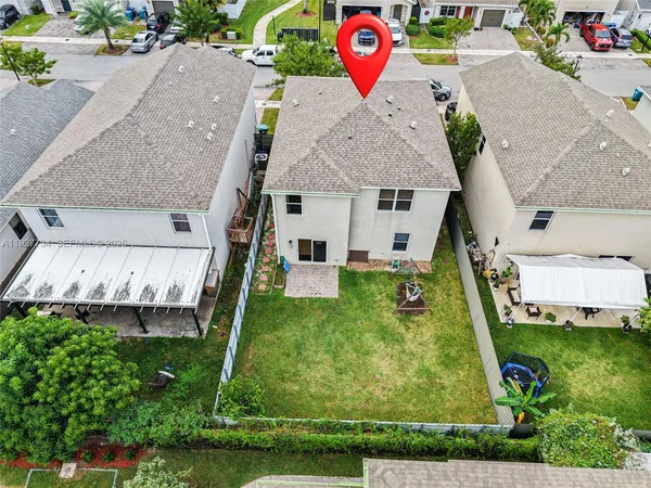 an aerial view of residential building and parking space