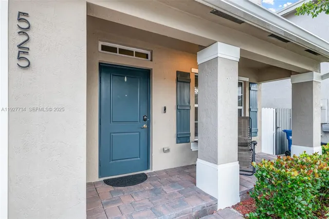 a view of a bathroom with a glass door and a shower