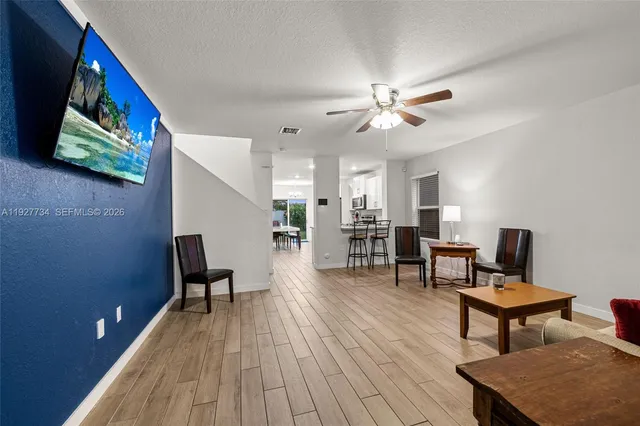 a work room with furniture and wooden floor