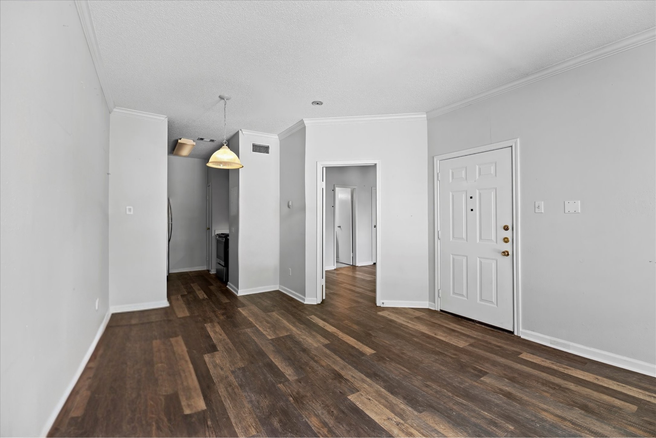 12166 Metric Boulevard, Unit 233 Austin, TX 78758 - Photo 6 of 13 a view of a room with wooden floor and yard