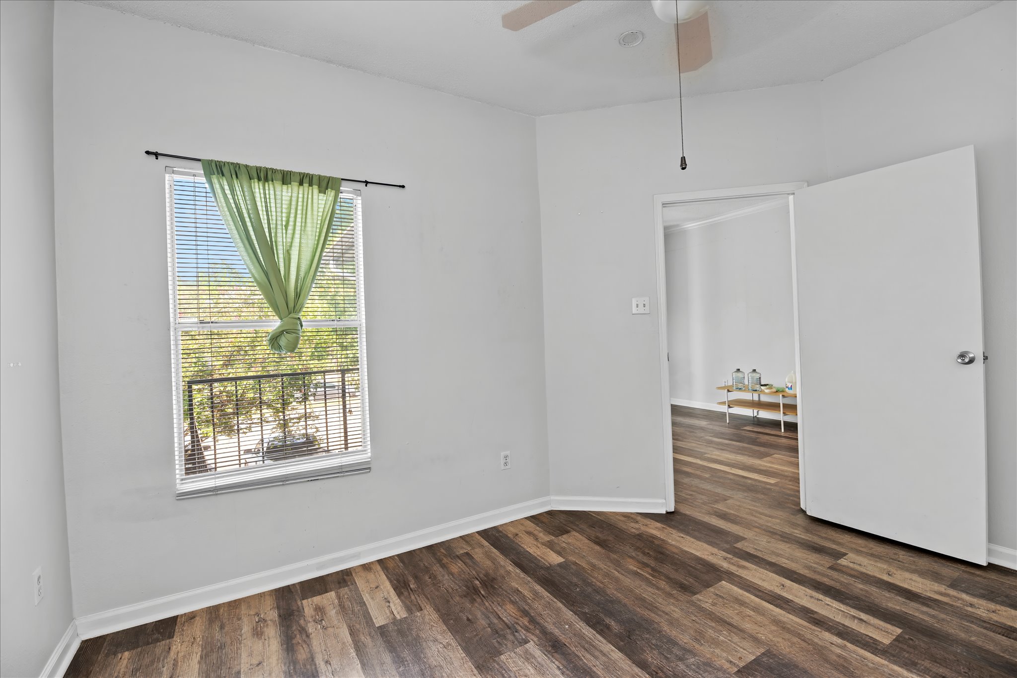 12166 Metric Boulevard, Unit 233 Austin, TX 78758 - Photo 8 of 13 a view of a livingroom with an empty space and a window