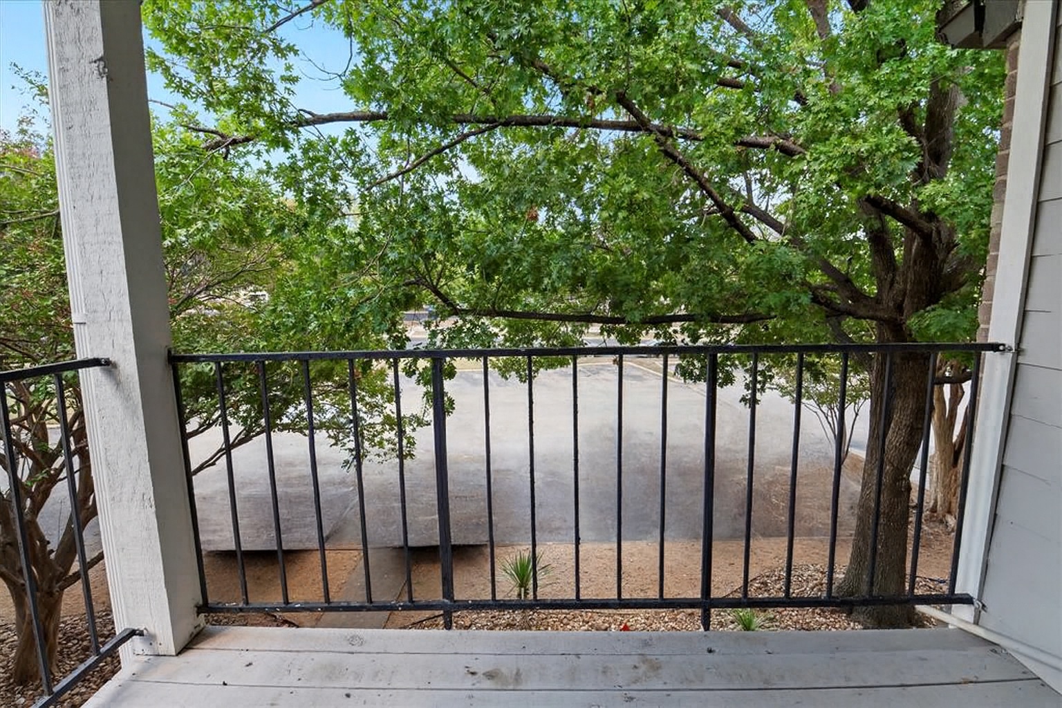 12166 Metric Boulevard, Unit 233 Austin, TX 78758 - Photo 10 of 13 a view of a wooden fence