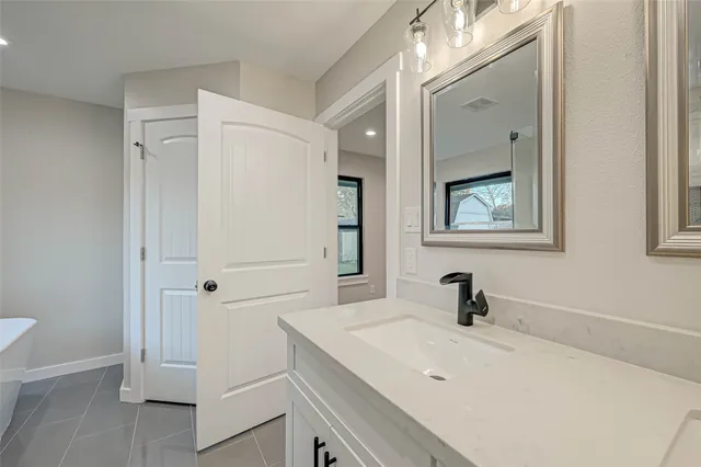 a bathroom with a sink and a bathtub