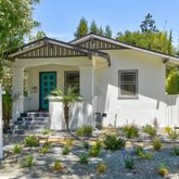 a front view of a house with garden