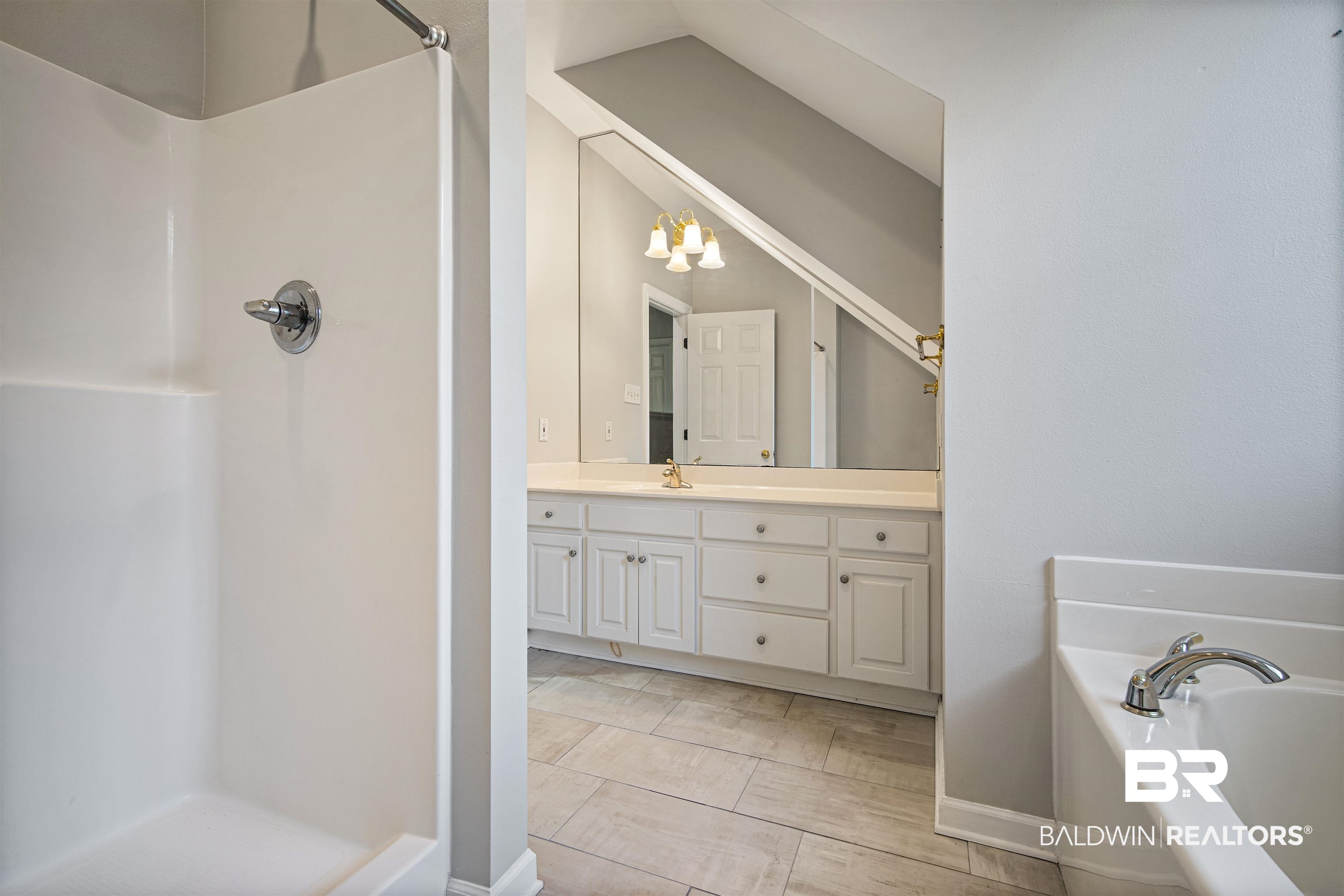 204 General Canby Loop Daphne, AL 36527 - Photo 24 of 36 Bathroom with tile patterned floors, separate shower and tub, vanity, and a chandelier