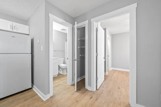 a view of an empty room and wooden floor