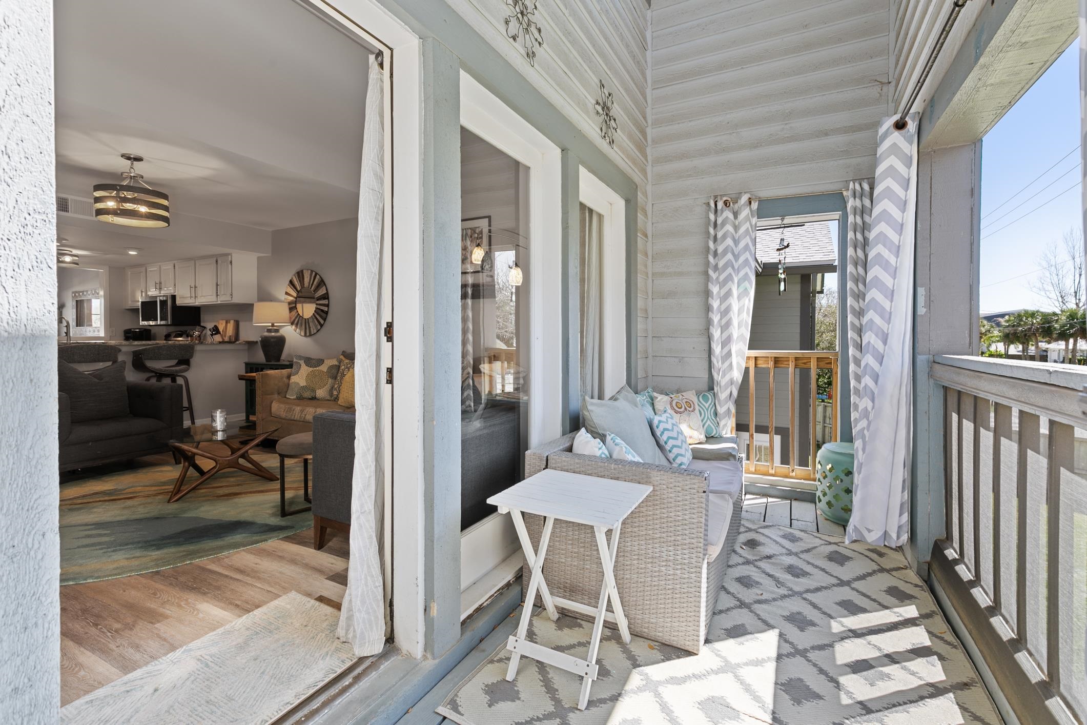 200 16th Street, Unit 202A St. Augustine, FL 32080 - Photo 19 of 39 a view of a dining room with furniture window and wooden floor