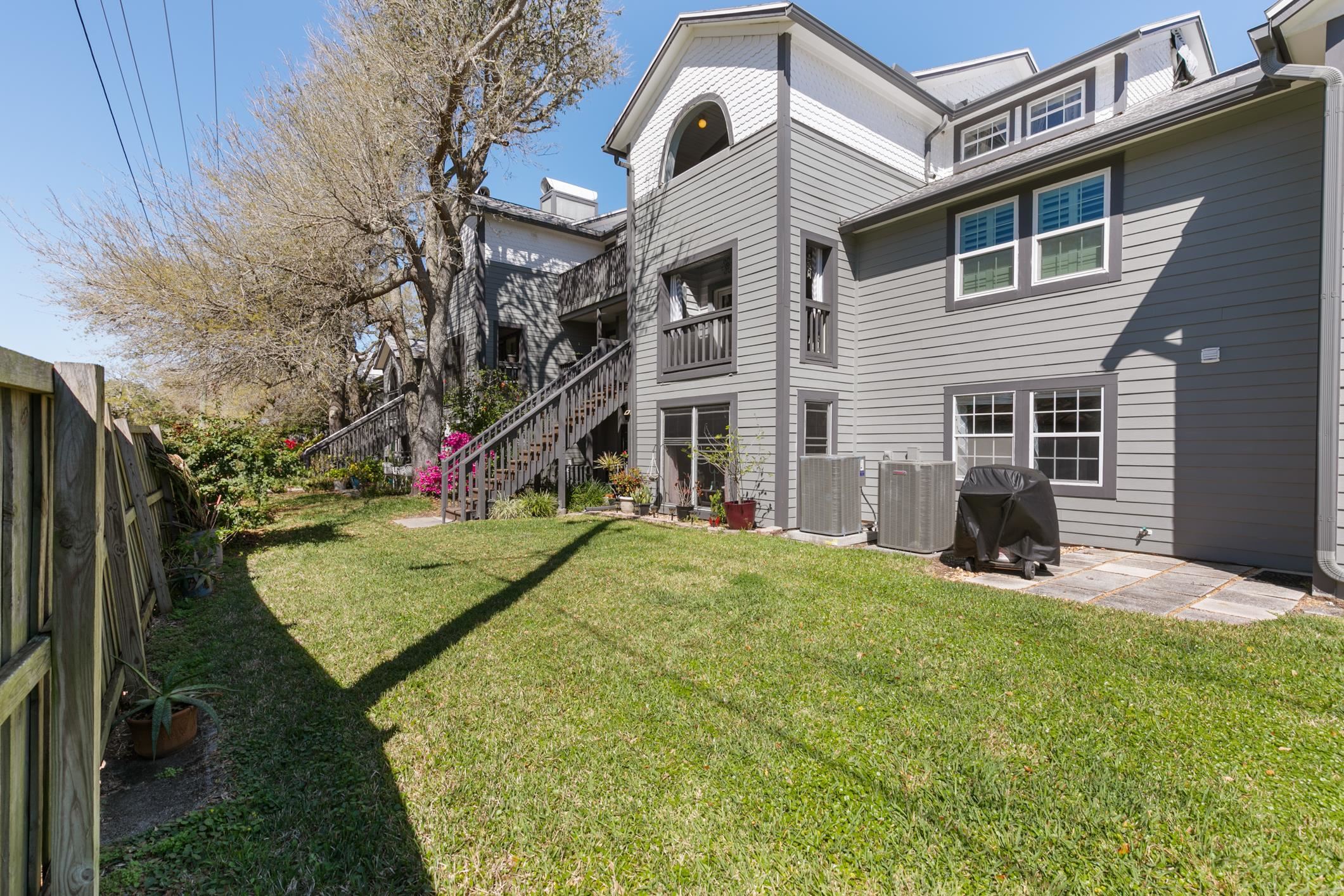 200 16th Street, Unit 202A St. Augustine, FL 32080 - Photo 20 of 39 a view of a house with a yard and garage