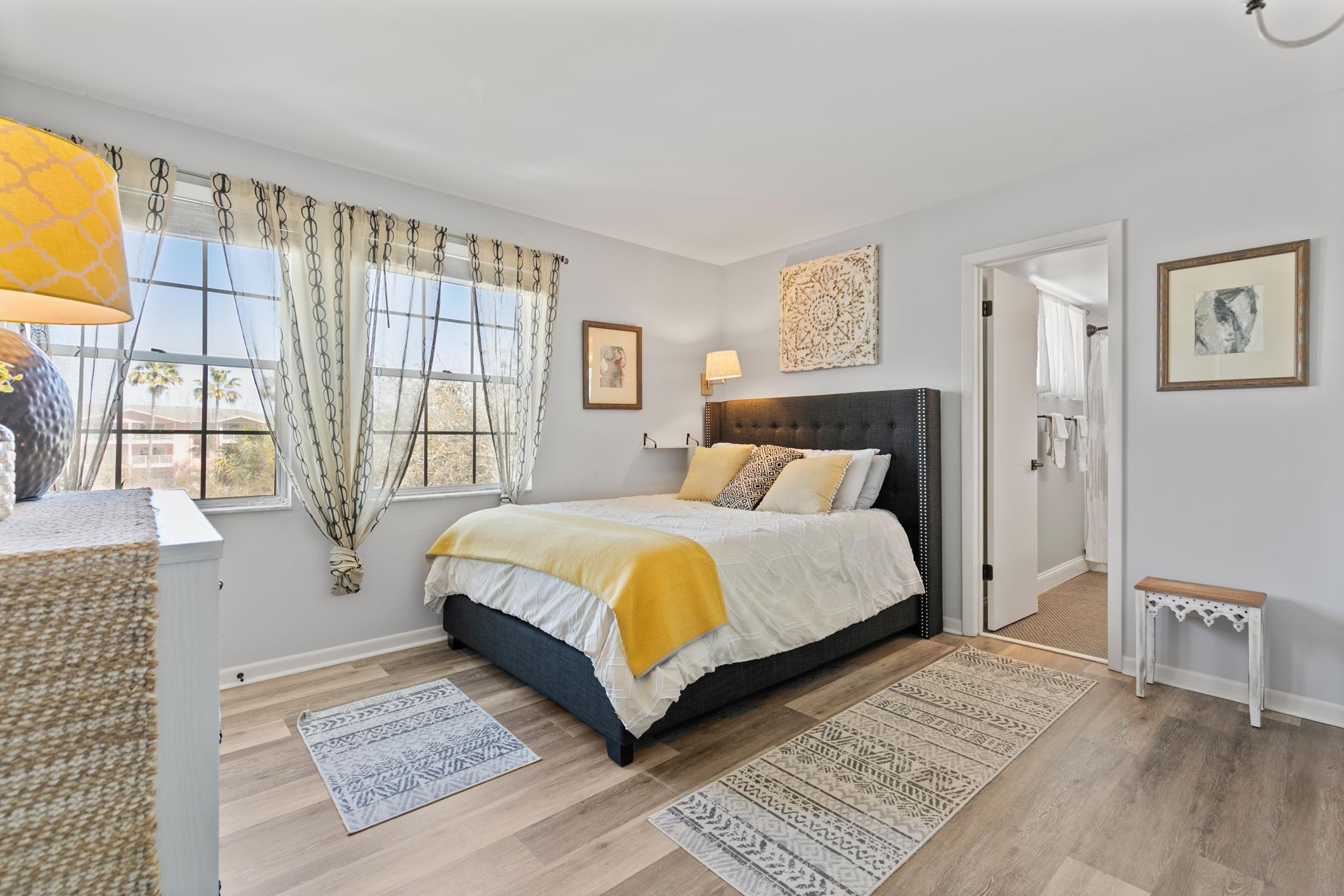 200 16th Street, Unit 202A St. Augustine, FL 32080 - Photo 23 of 39 a bedroom with a large bed and a window