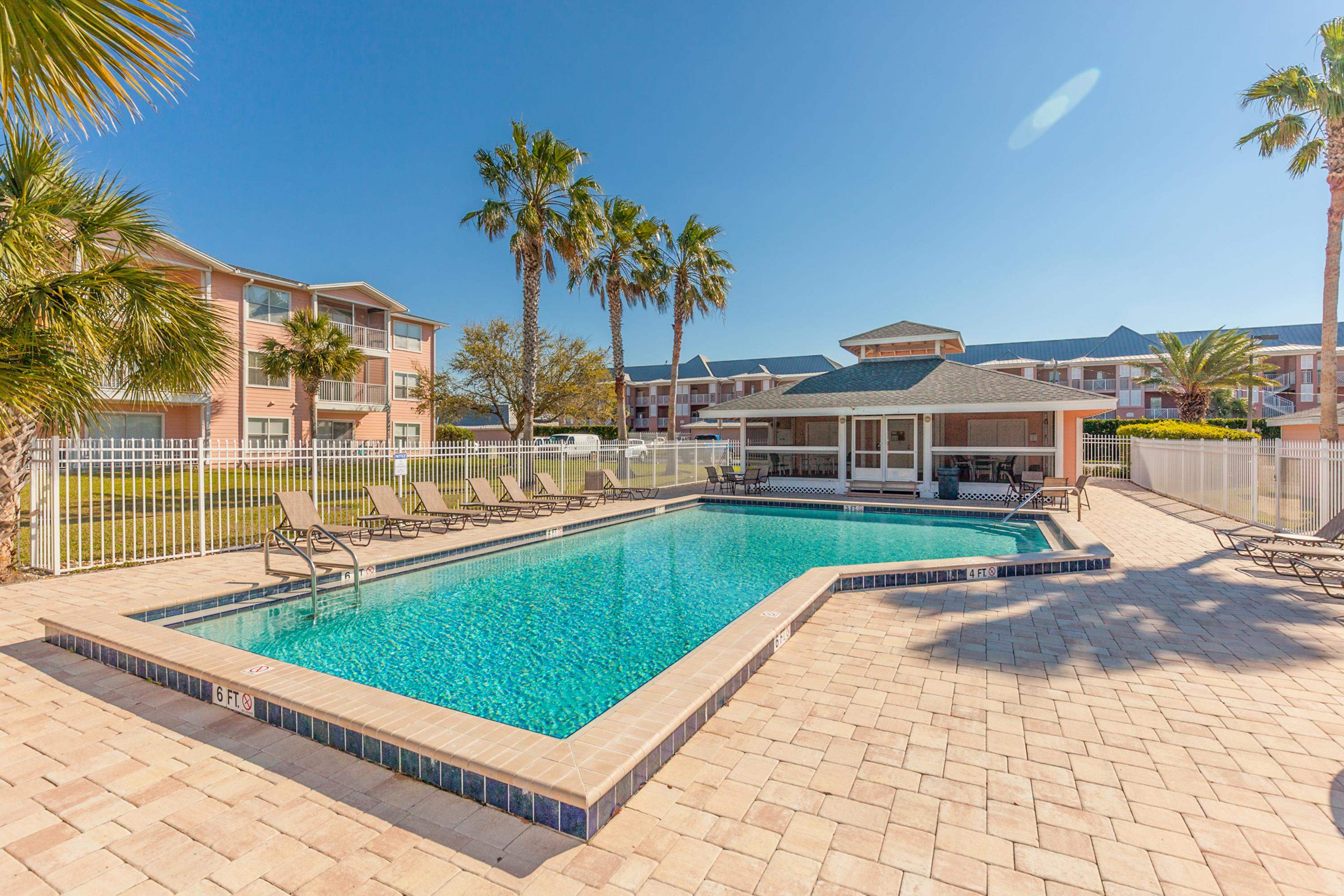 200 16th Street, Unit 202A St. Augustine, FL 32080 - Photo 34 of 39 a view of swimming pool with outdoor seating and yard