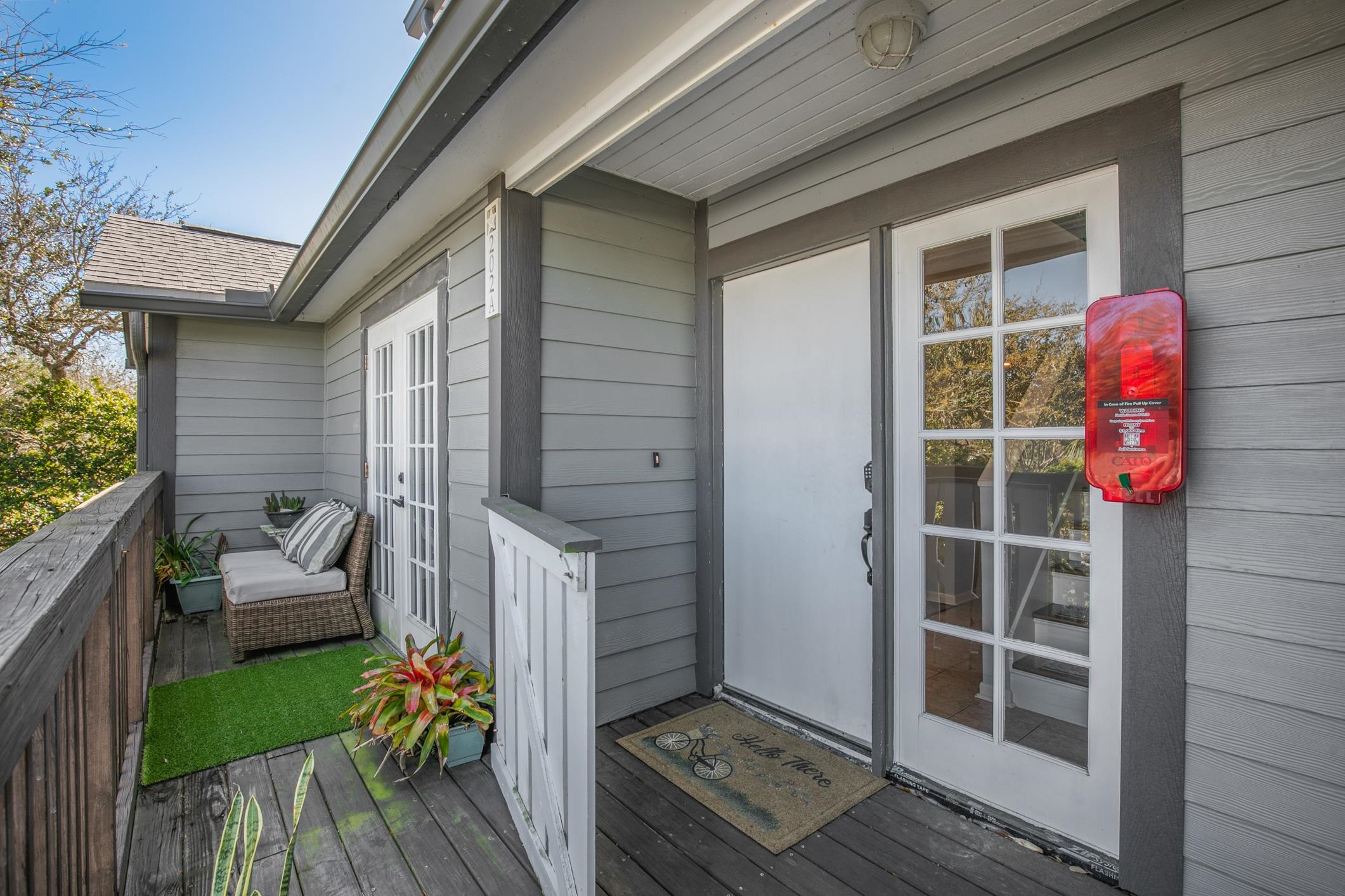 200 16th Street, Unit 202A St. Augustine, FL 32080 - Photo 4 of 39 a front view of a house with a yard