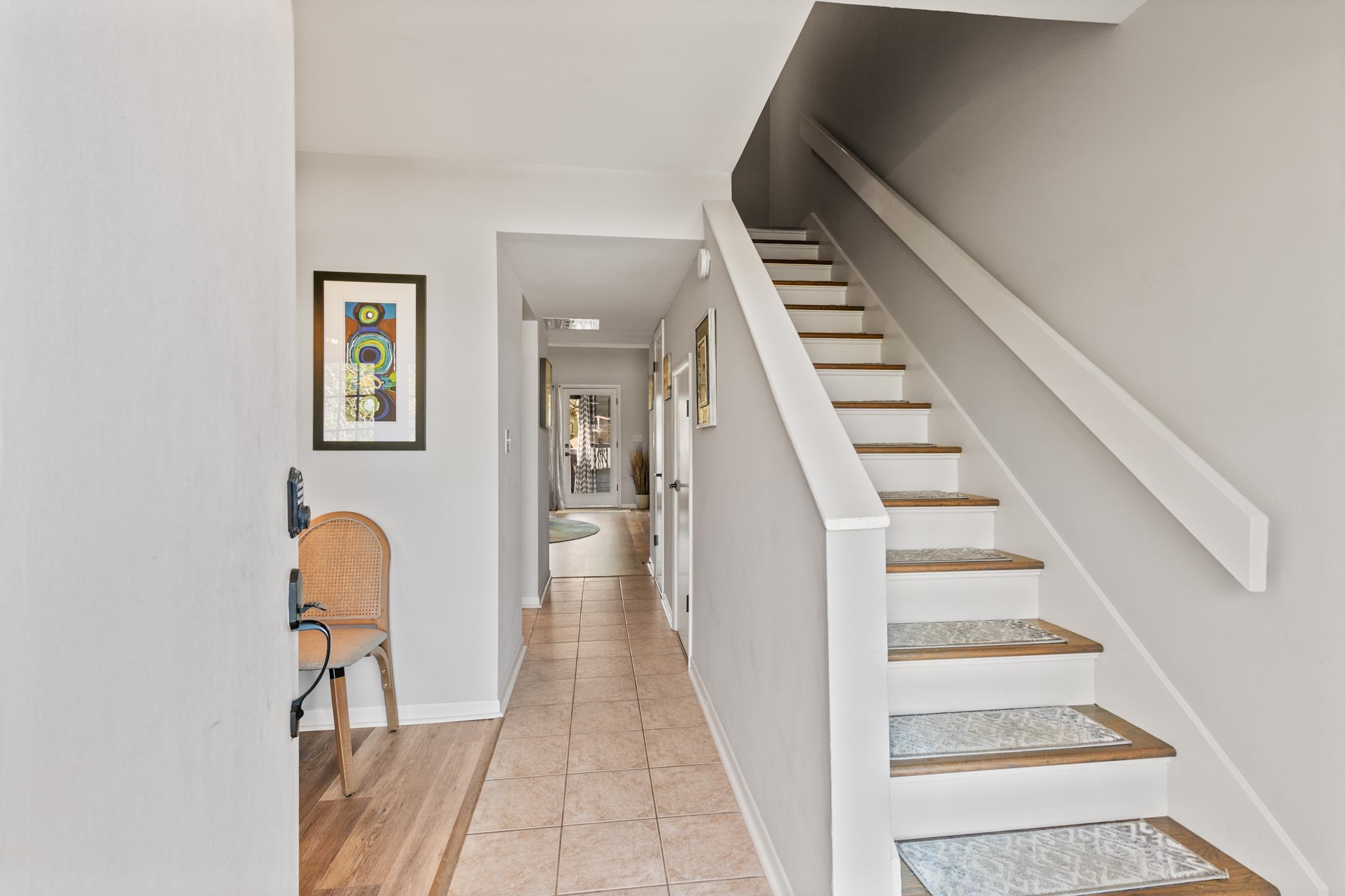200 16th Street, Unit 202A St. Augustine, FL 32080 - Photo 5 of 39 a view of entryway and hall with wooden floor