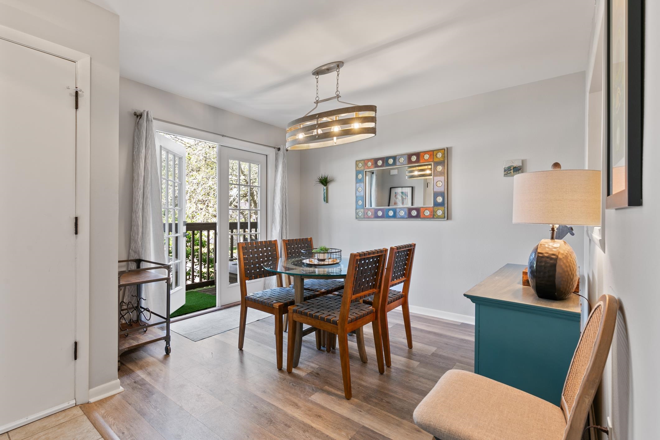 200 16th Street, Unit 202A St. Augustine, FL 32080 - Photo 6 of 39 a dining room with furniture a window and wooden floor