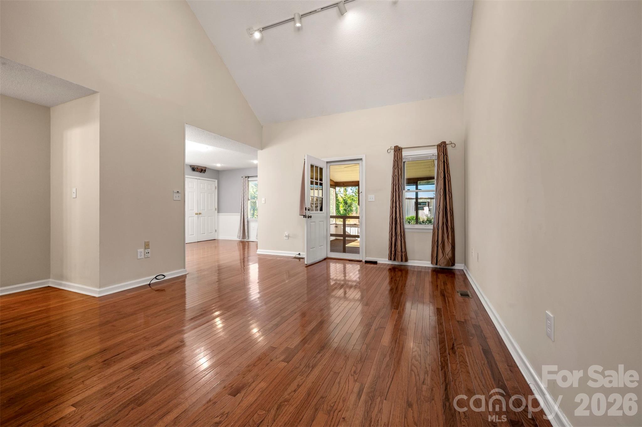 506 Pleasant Street Spindale, NC 28160 - Photo 7 of 42 wooden floor in an empty room with a window
