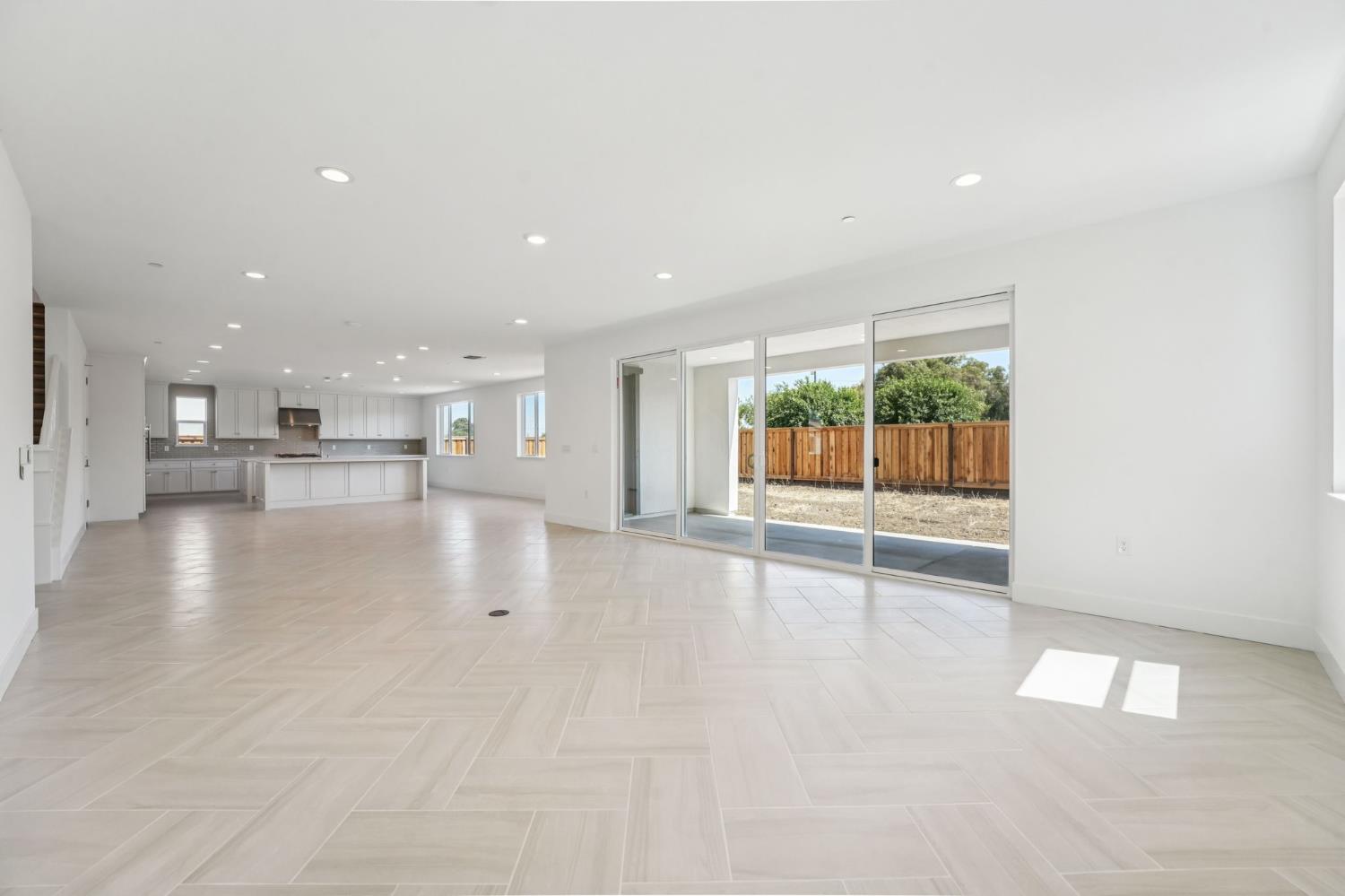 464 Trellis Way Brentwood, CA 94513 - Photo 12 of 22 a view of an empty room with a kitchen view