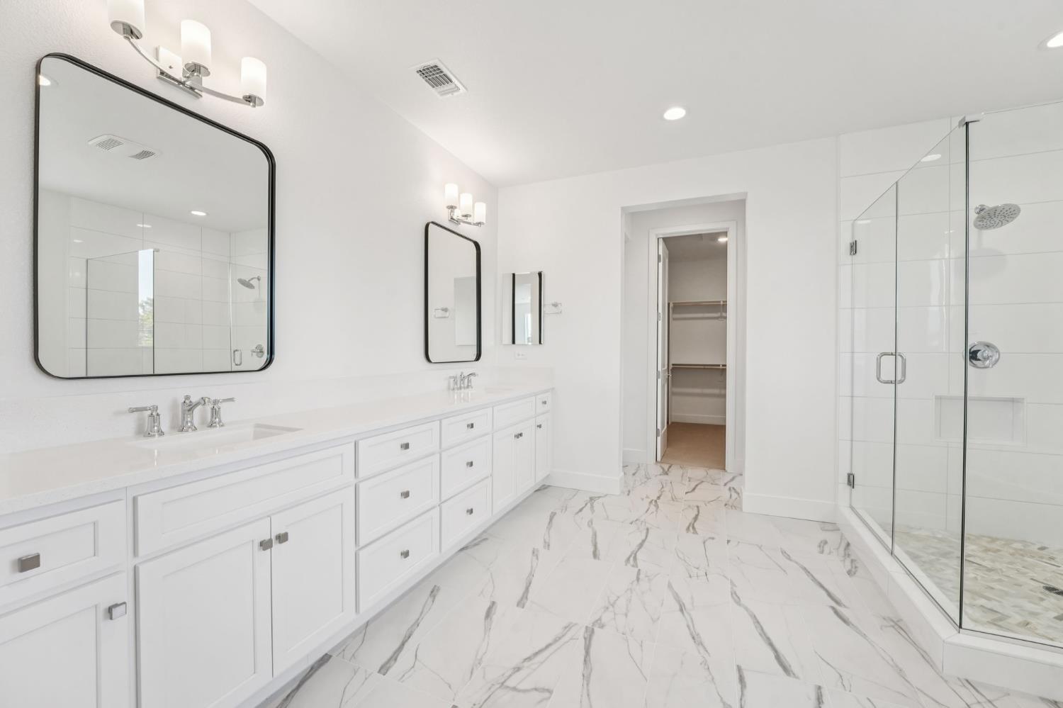 464 Trellis Way Brentwood, CA 94513 - Photo 19 of 22 a spacious bathroom with double vanity a mirror and a shower