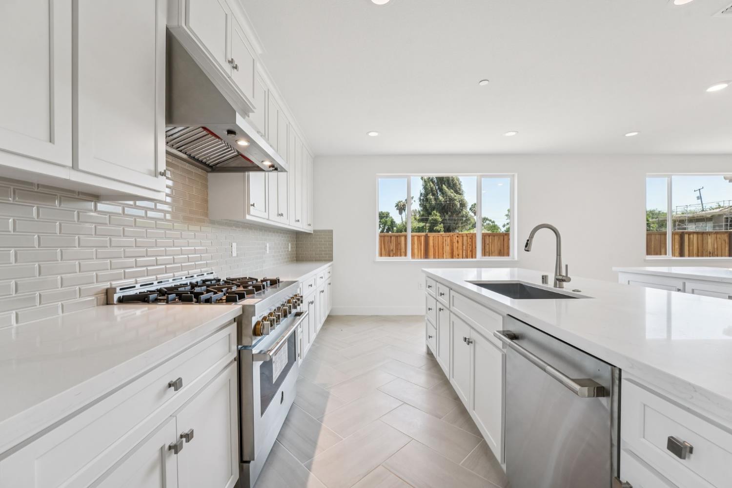 464 Trellis Way Brentwood, CA 94513 - Photo 8 of 22 a kitchen with stainless steel appliances granite countertop a sink and a stove top oven