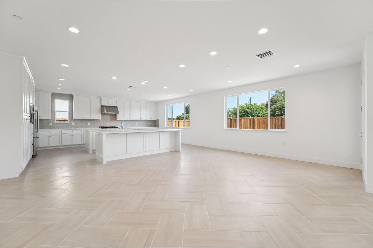464 Trellis Way Brentwood, CA 94513 - Photo 10 of 22 a view of a kitchen with a sink wooden cabinets and a window