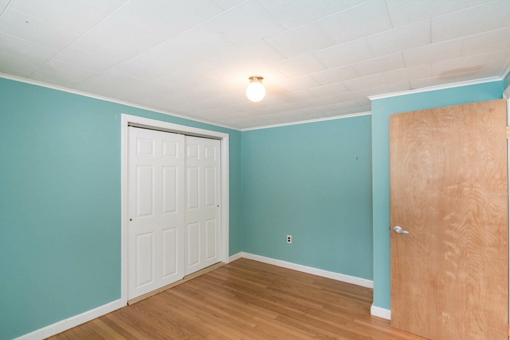 300 Main Road Westhampton, MA 01027 - Photo 18 of 35 an empty room with wooden floor and closet