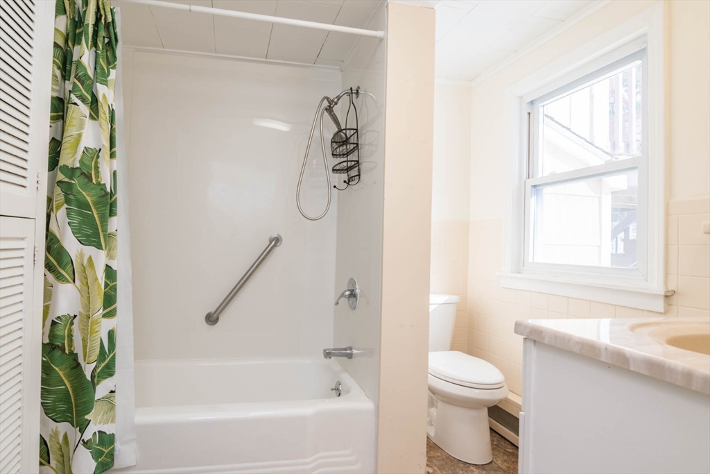 300 Main Road Westhampton, MA 01027 - Photo 23 of 35 a bathroom with a granite countertop sink a toilet and a bathtub