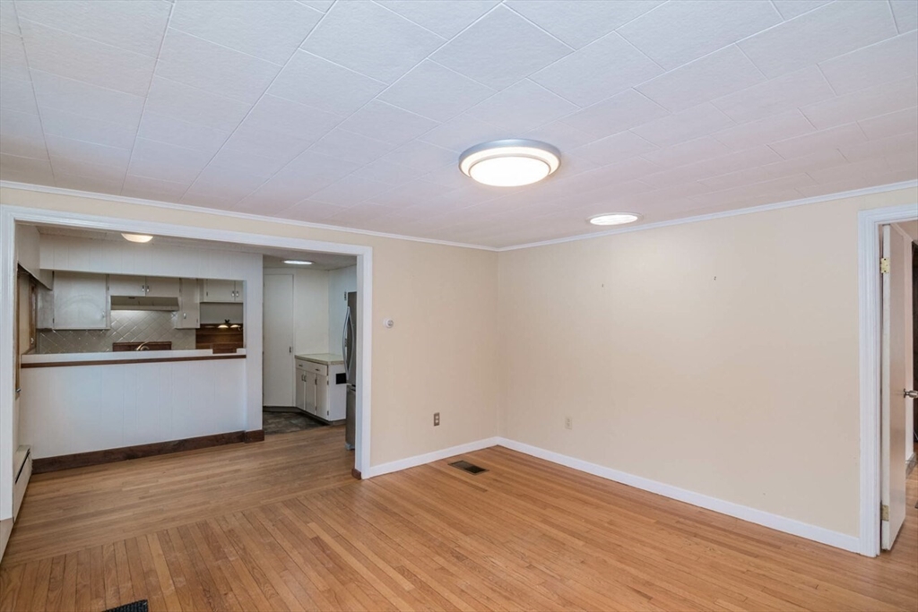 300 Main Road Westhampton, MA 01027 - Photo 3 of 35 a view of empty room with wooden floor and kitchen view