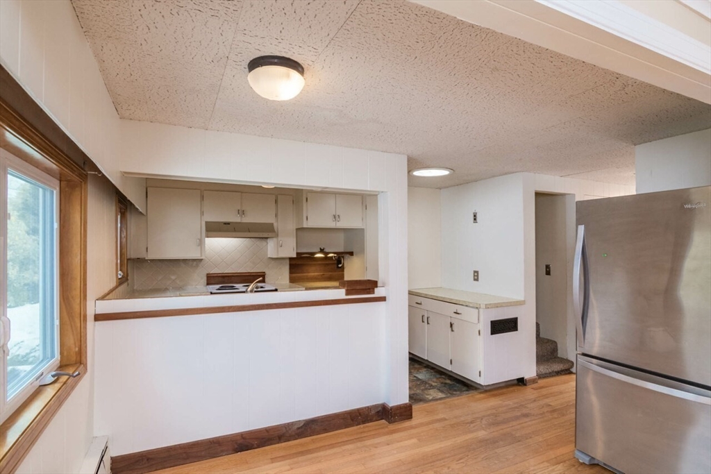 300 Main Road Westhampton, MA 01027 - Photo 7 of 35 a kitchen with stainless steel appliances a refrigerator and a stove top oven