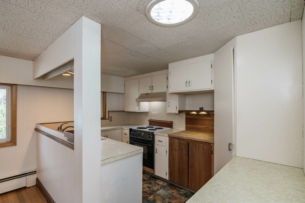 300 Main Road Westhampton, MA 01027 - Photo 8 of 35 a kitchen with cabinets stainless steel appliances and a counter space
