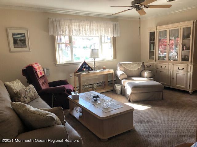 6 B Sunset Road, Unit 53 Whiting, NJ 08759 - Photo 2 of 8 a living room with furniture a rug and a window