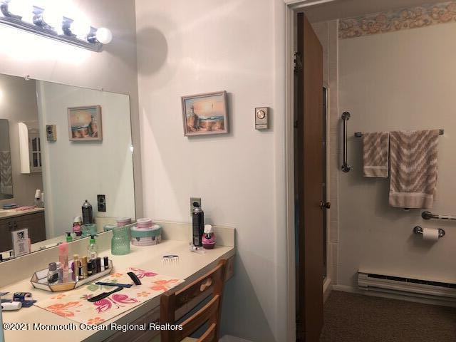 6 B Sunset Road, Unit 53 Whiting, NJ 08759 - Photo 7 of 8 a room with a bed and a mirror