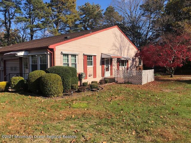 6 B Sunset Road, Unit 53 Whiting, NJ 08759 - Photo 8 of 8 a view of a house with a yard and large tree