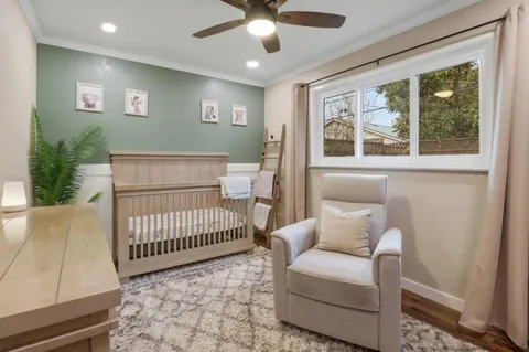 a bedroom with furniture and a window