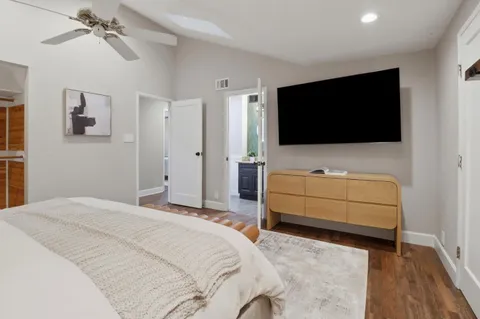 a bedroom with a bed and a table in it