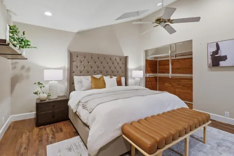 a bathroom with a shower a mirror and a toilet