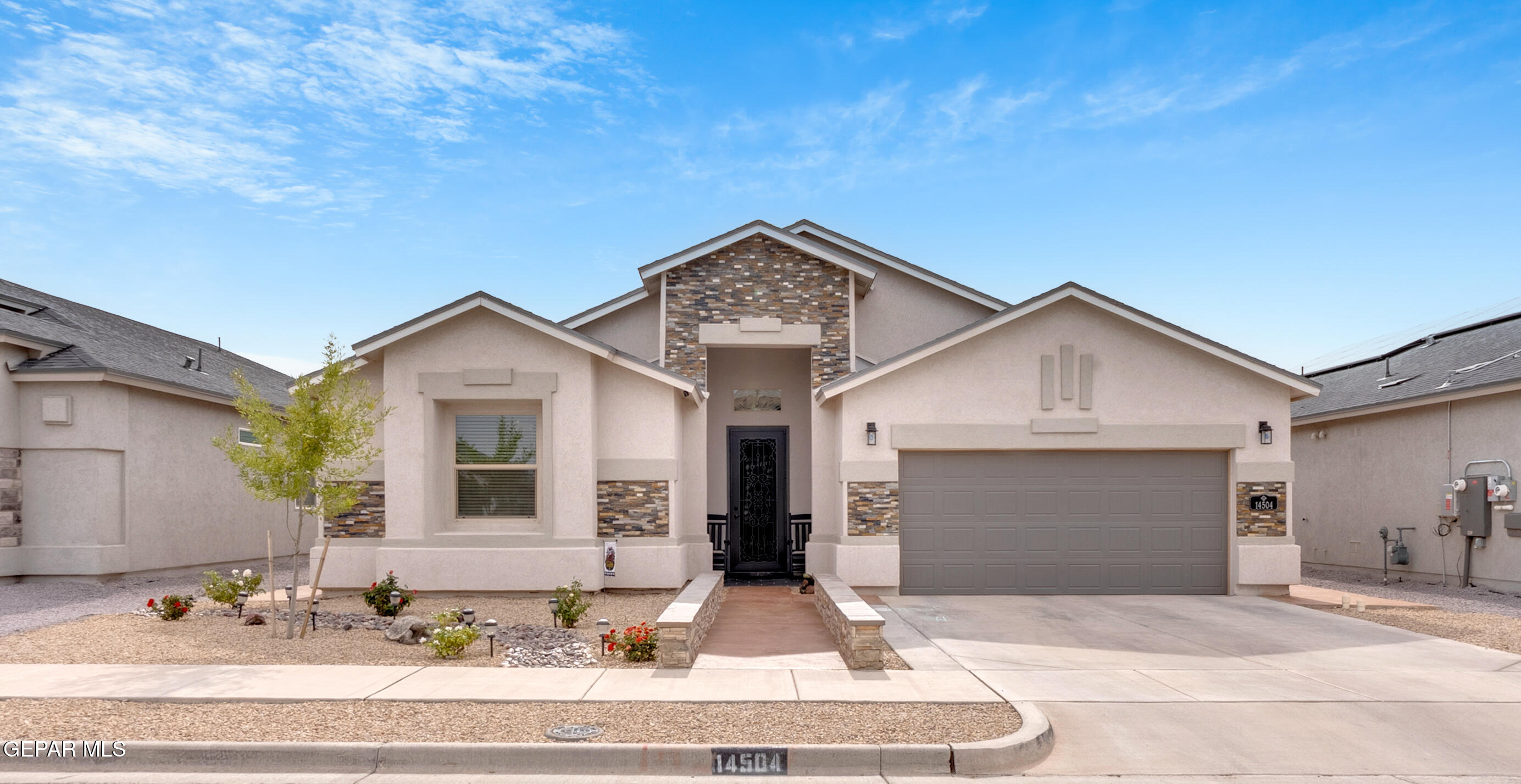 14504 Israel Rodolfo Street El Paso, TX 79938 - Photo 1 of 1 a front view of a house with yard