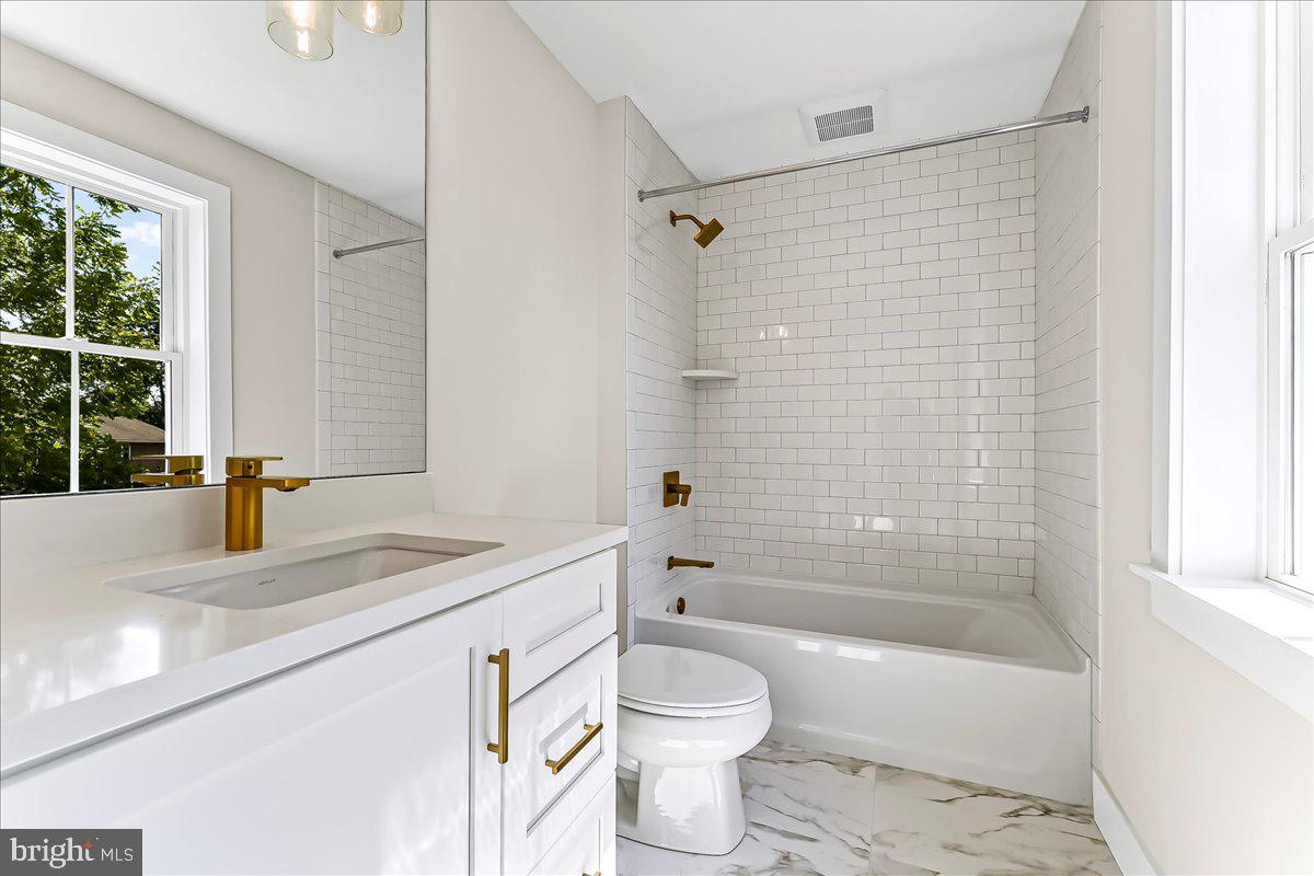 738 South Matlack Street West Chester, PA 19382 - Photo 17 of 23 a bathroom with a sink a toilet and a bathtub
