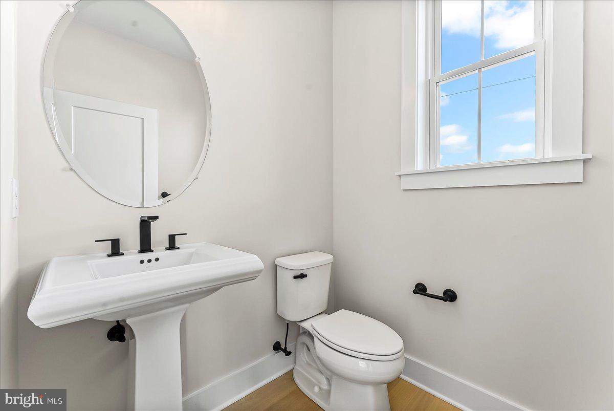 738 South Matlack Street West Chester, PA 19382 - Photo 18 of 23 a bathroom with a sink mirror and toilet