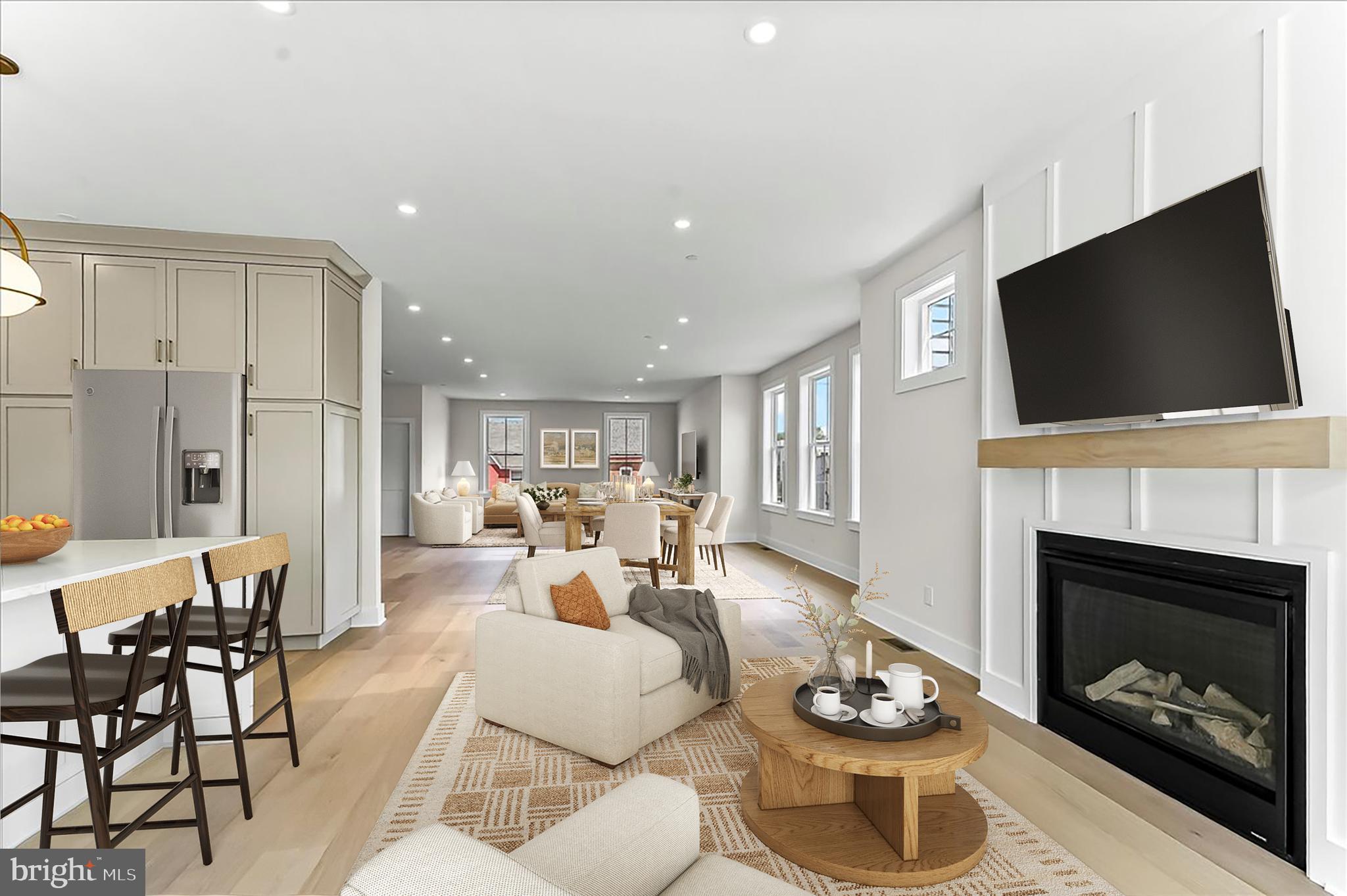738 South Matlack Street West Chester, PA 19382 - Photo 9 of 23 a living room with furniture a fireplace and flat screen tv
